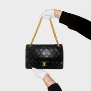 CHANEL • Timeless 27 double flap bag with a reissue chain • Black