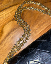 CHANEL • Timeless 27 double flap bag with a reissue chain • Black